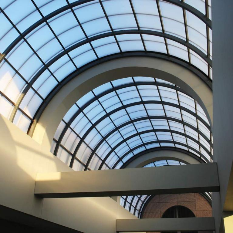 Interior photo of the view through the rooftop arched-glass window at Tower Place.